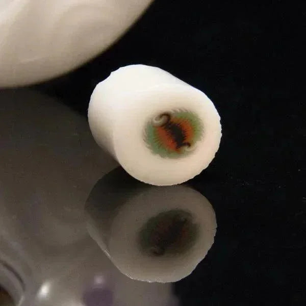 White glass pipe with colorful swirl design, ideal for heady glass collectors and vaporizer enthusiasts.