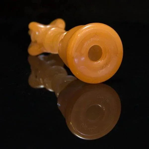 Amber glass pipe with intricate design, ideal for heady glass collectors and vaporizer enthusiasts.
