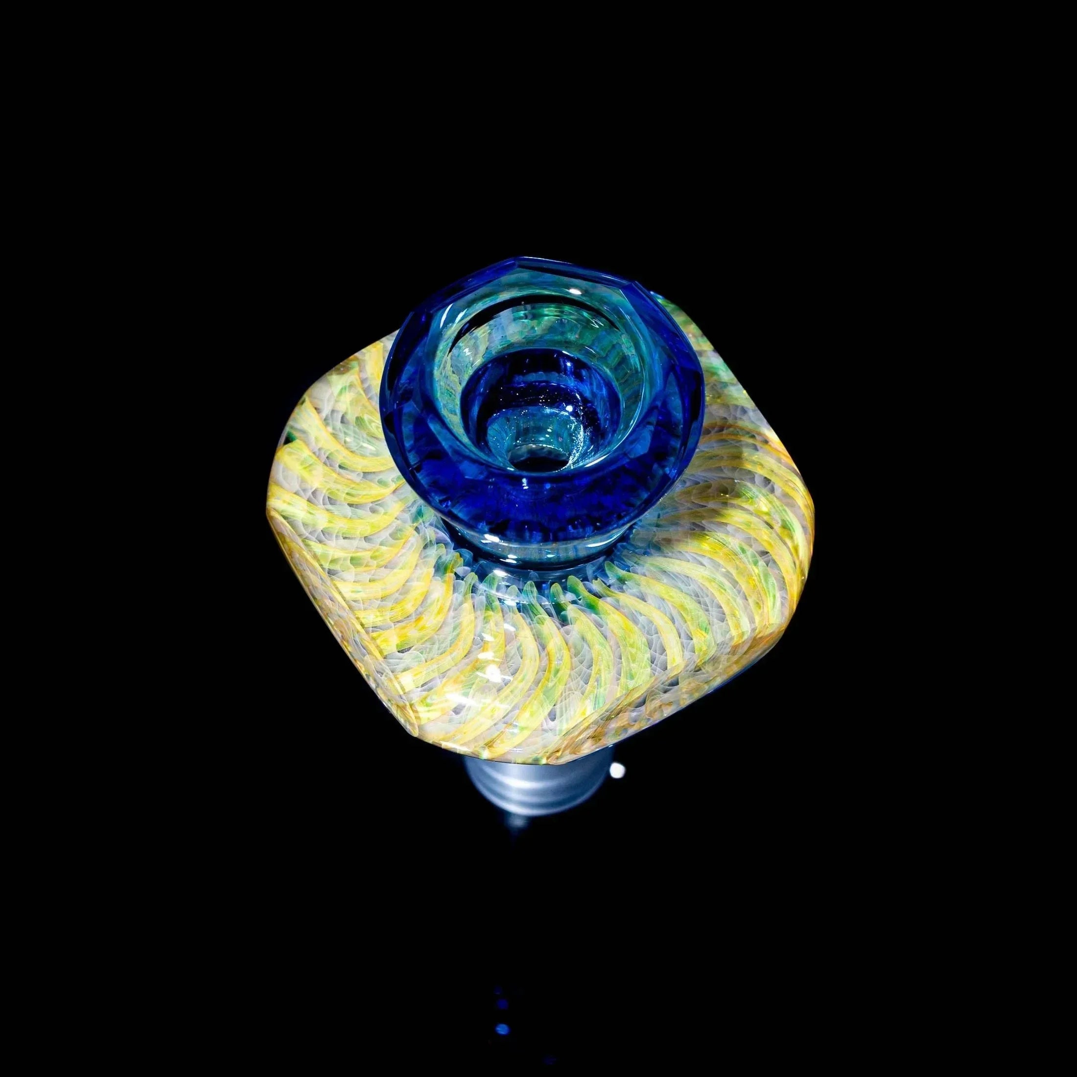 Light cobalt blue 14mm glass bowl slide with yellow swirling patterns, shown on black background.