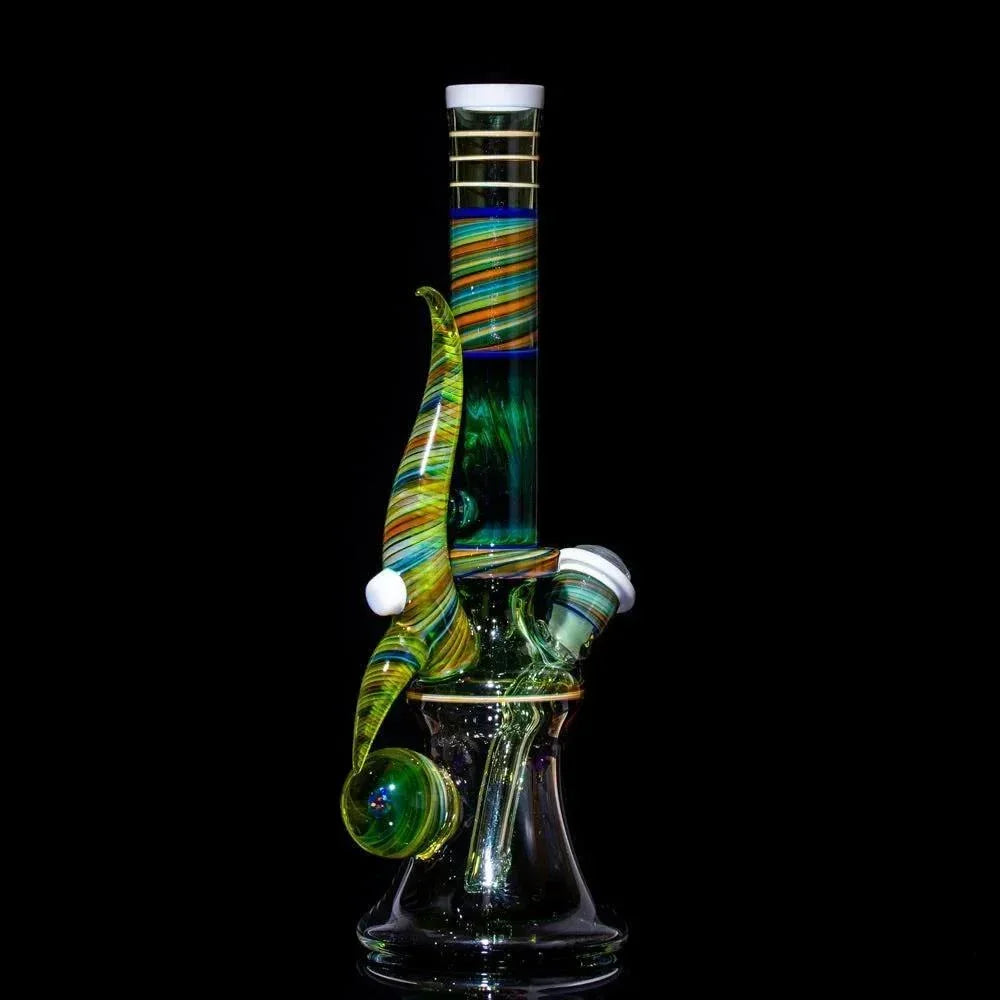 Colorful striped heady glass bong with green swirls and percolator, studio shot on black background