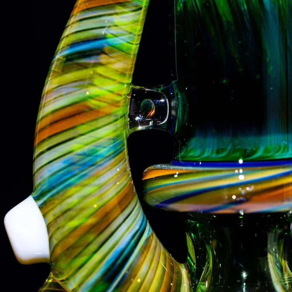 Vibrant rainbow-swirl heady glass pipe with green, blue, and amber hues, showcasing artisan craftsmanship.