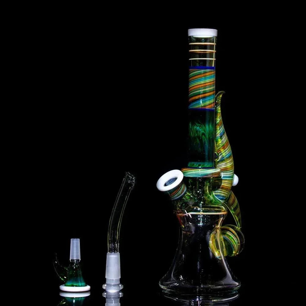 Colorful heady glass bong with swirls, bowl, and downstem on black background