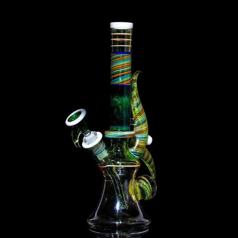 Colorful striped glass bong with green swirls and white accents, studio shot on black background