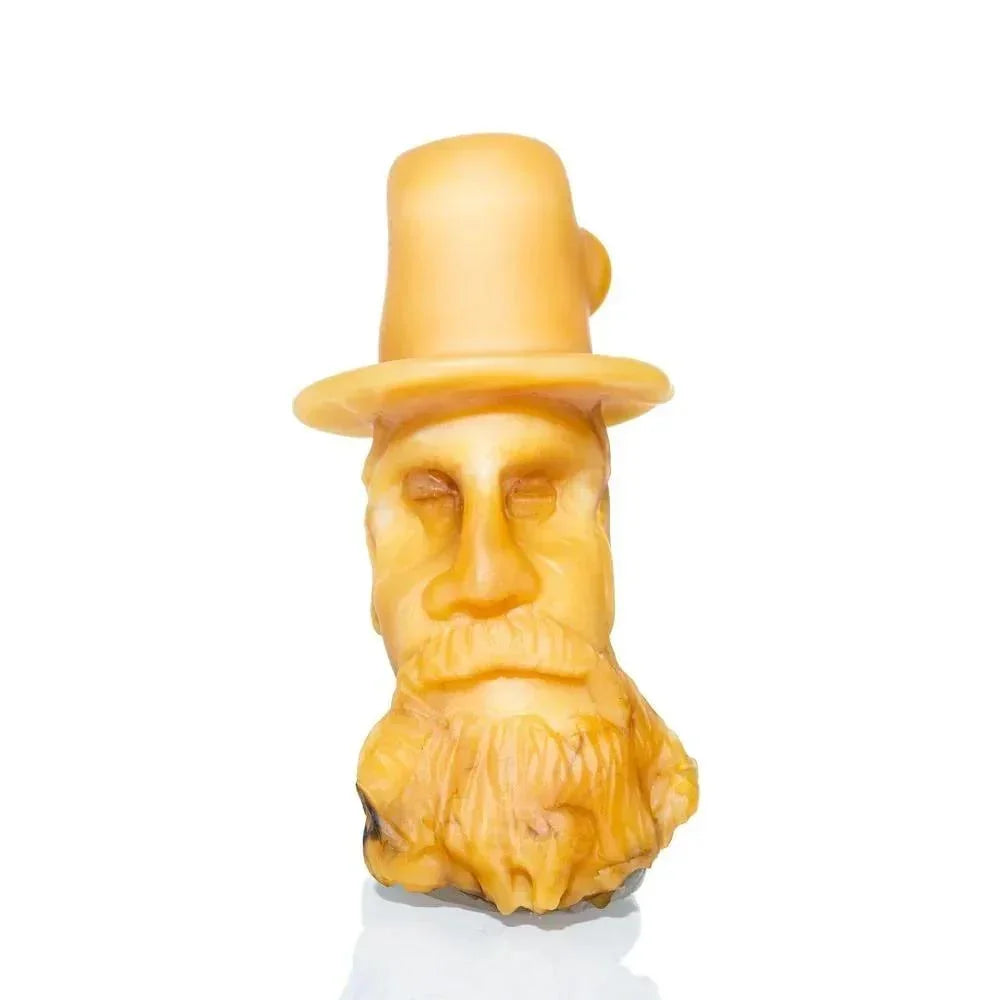 Handcrafted pipe shaped like an old man's face with a beard and top hat, yellow glass