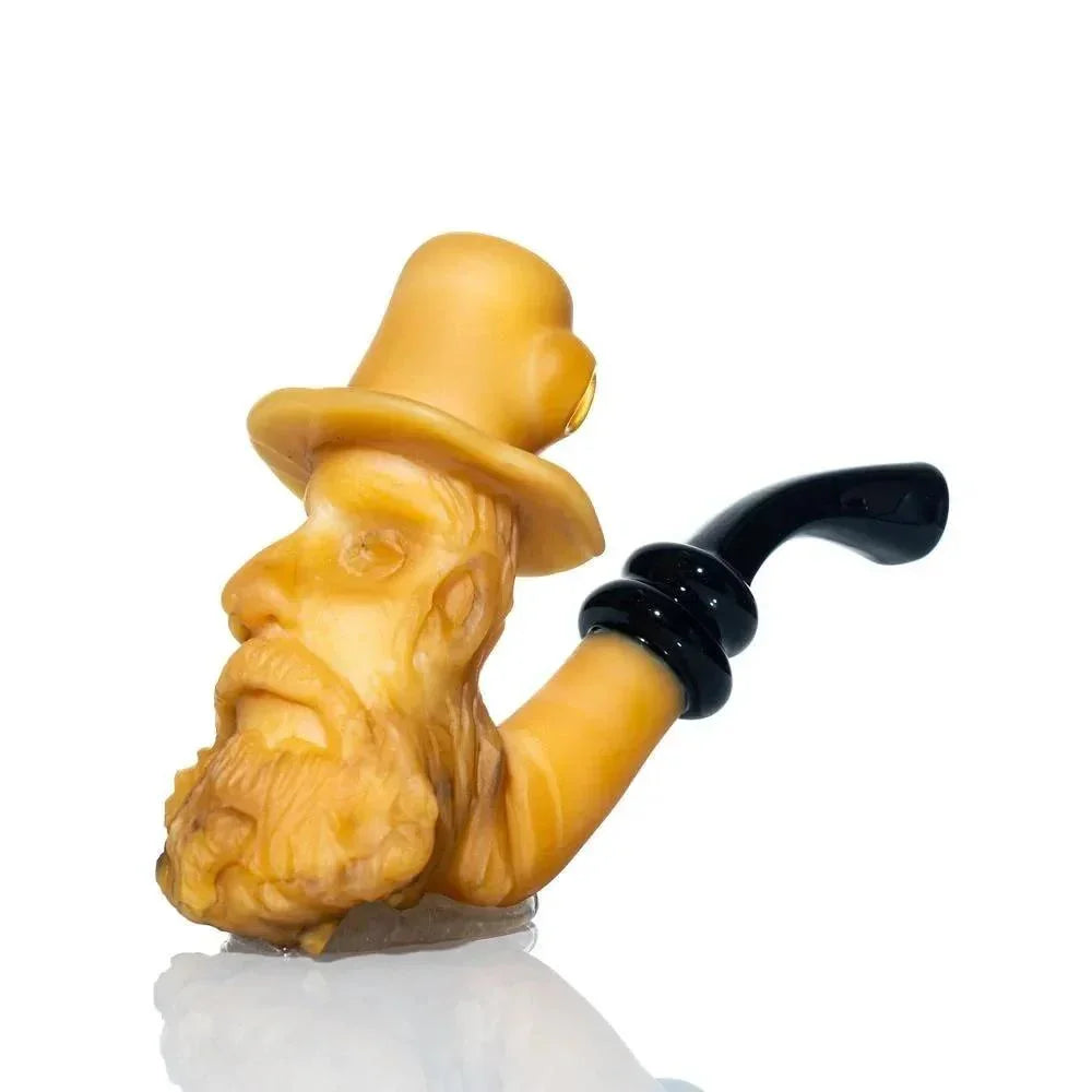 Hand-carved glass pipe shaped like an old man's bearded face with a top hat and black stem