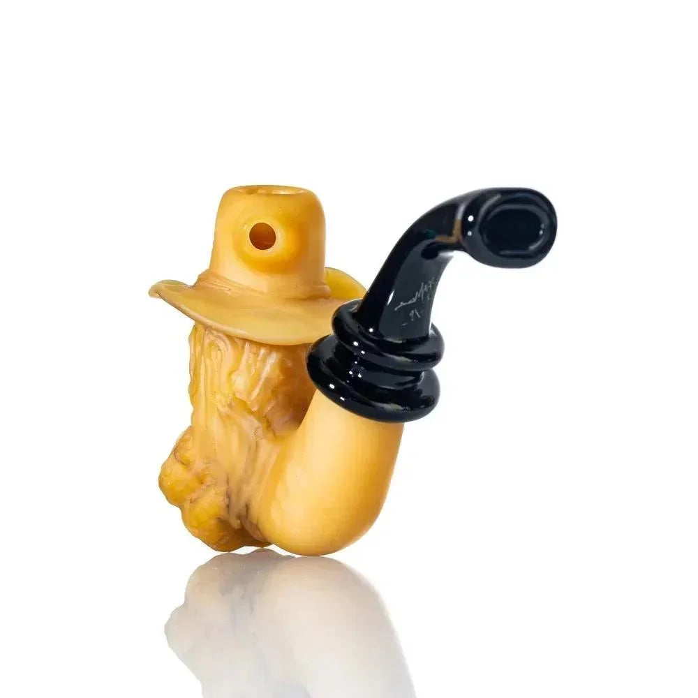 Handcrafted glass pipe shaped like an old man with a hat and curved black stem on white background