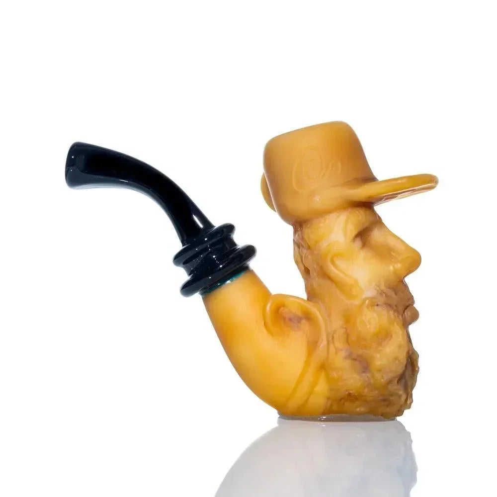 Sculpted glass pipe shaped like an old man with a hat and beard, black mouthpiece