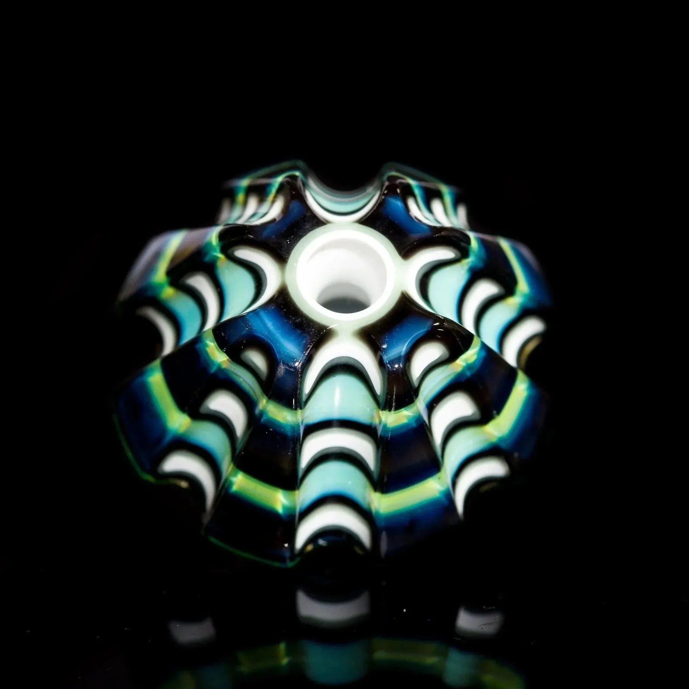 Hand-blown glass bowl with blue, green, and white swirls, featuring intricate patterns and a glossy finish.