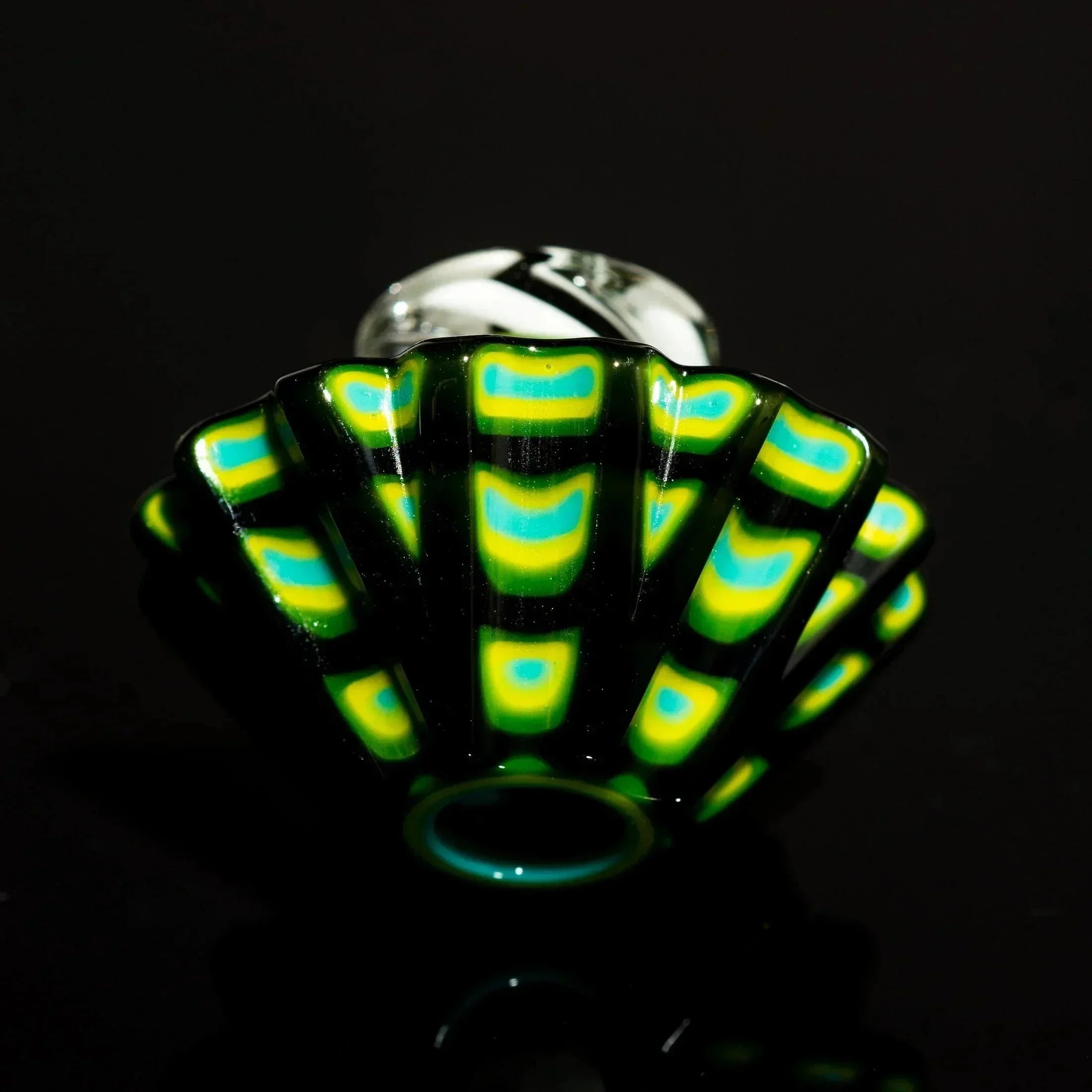 Handblown glass pipe with vibrant green, yellow, and blue fan-shaped design on black background
