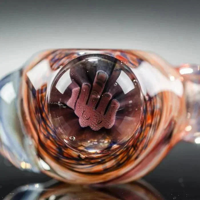 Hand-shaped glass pipe with swirls of amber and purple, featuring intricate heady glass artistry.