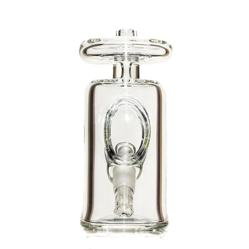 Clear glass water pipe with thick base and unique internal chamber design on white background