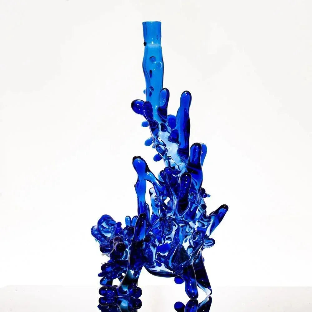 Vibrant blue heady glass pipe with intricate bubble design, perfect for smoke shop collections