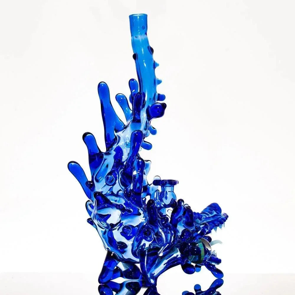 Vibrant blue heady glass pipe with intricate coral-like design, perfect for collectors and enthusiasts.