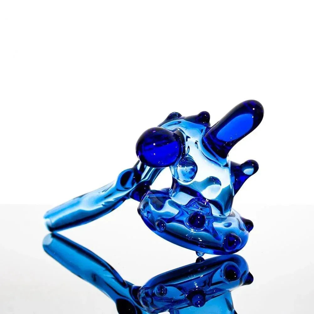 Vibrant blue heady glass pipe with intricate bubbles and reflective surface, showcasing artisan craftsmanship.