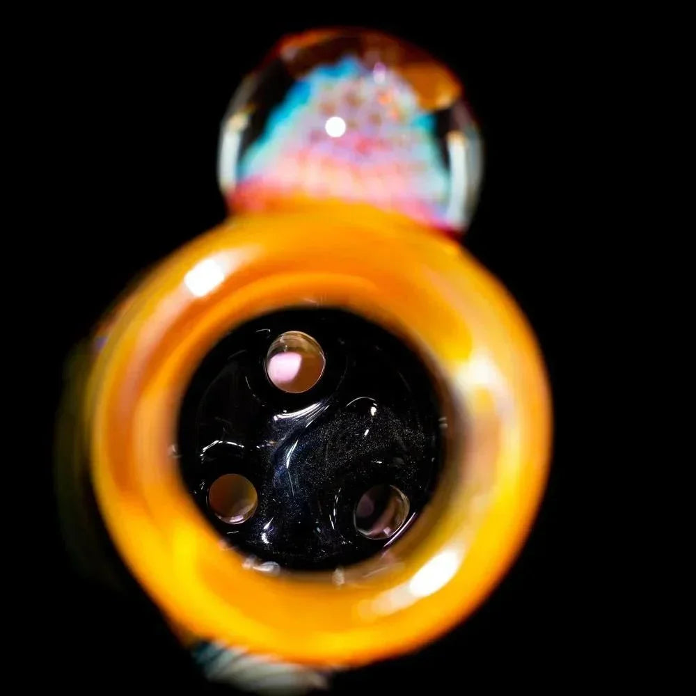 Closeup of a glass water pipe triple pillar perc tube with colorful detailing