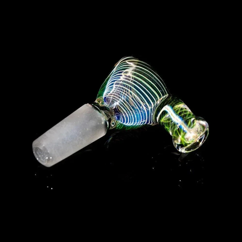 Colorful glass slide bowl with swirling line patterns on a black background
