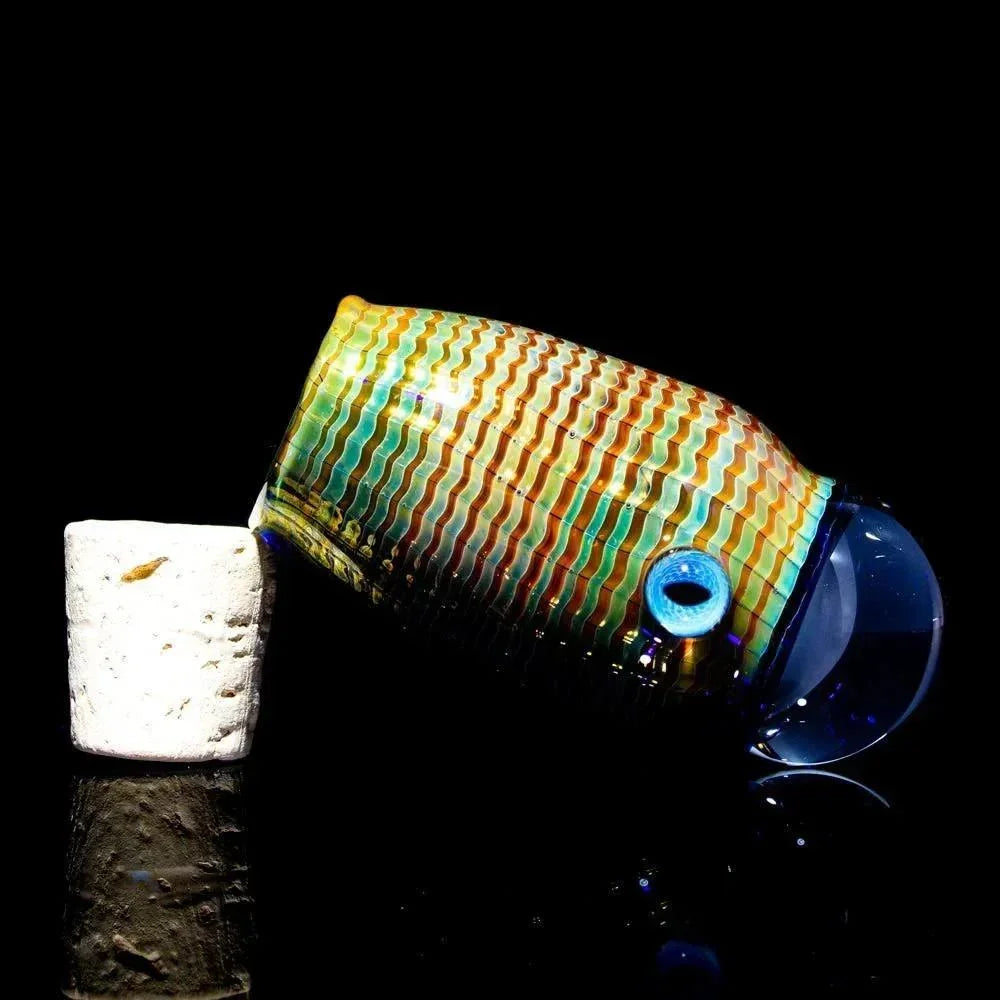 Colorful glass jar with wavy patterned design and cork stopper on black background