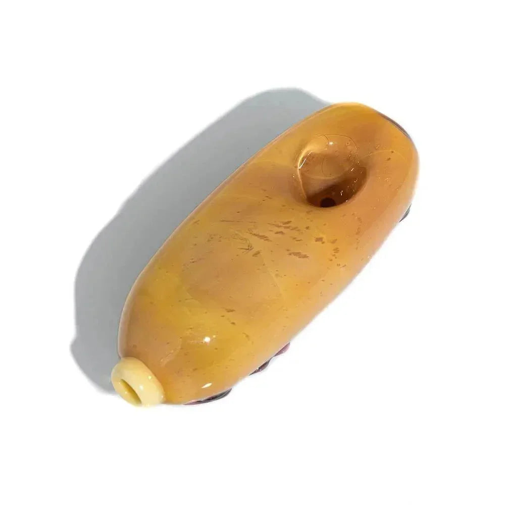 Handcrafted amber glass smoking pipe with a smooth surface and simple design on white background