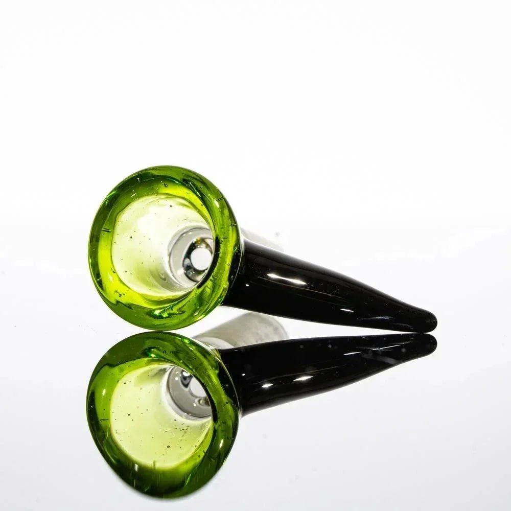Green glass bowl slide with black handle and single hole, mirrored on reflective surface