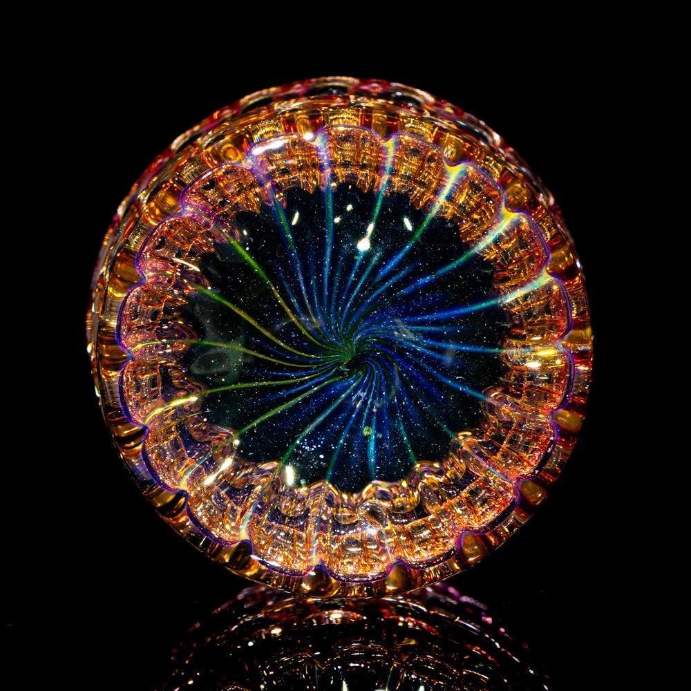 Intricate hand-blown glass jar with colorful, cosmic swirl design, displayed on black background