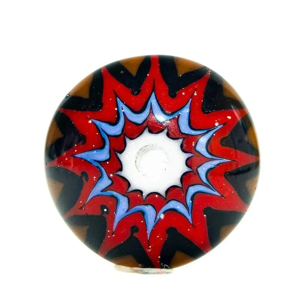 Red and black chevron lentil glass bead with blue and white starburst pattern