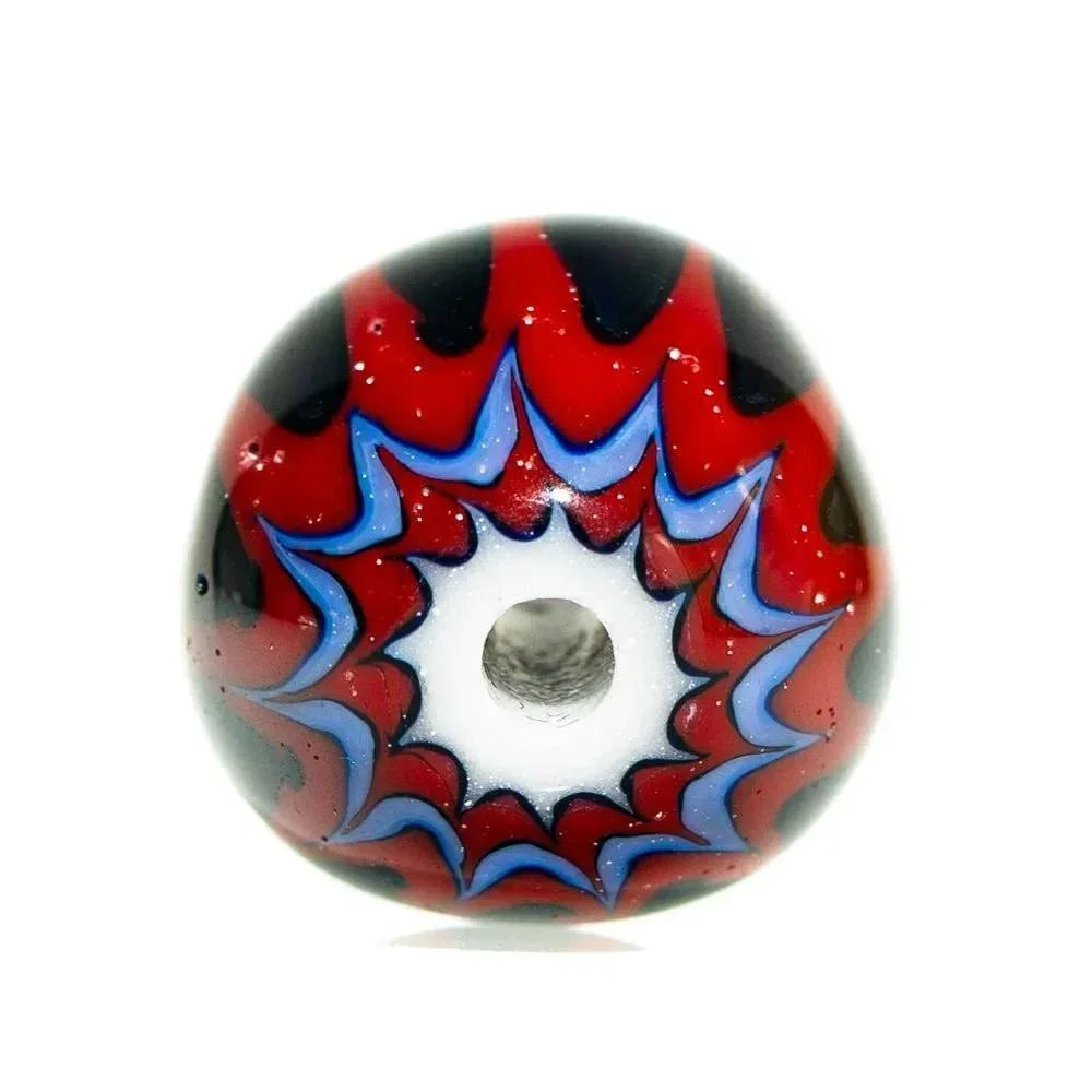 Handmade marquise glass bead with red, black, and blue chevron starburst pattern