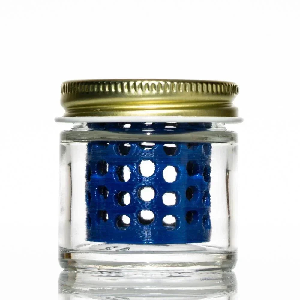 Small glass jar with metal lid, blue perforated insert inside, accessory storage container