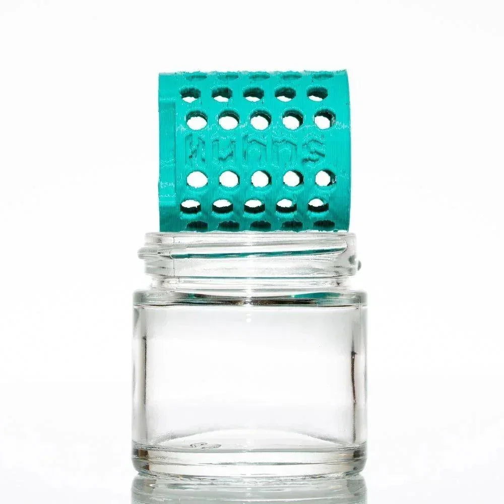 Clear glass jar with teal perforated washing station insert for glass cleaning