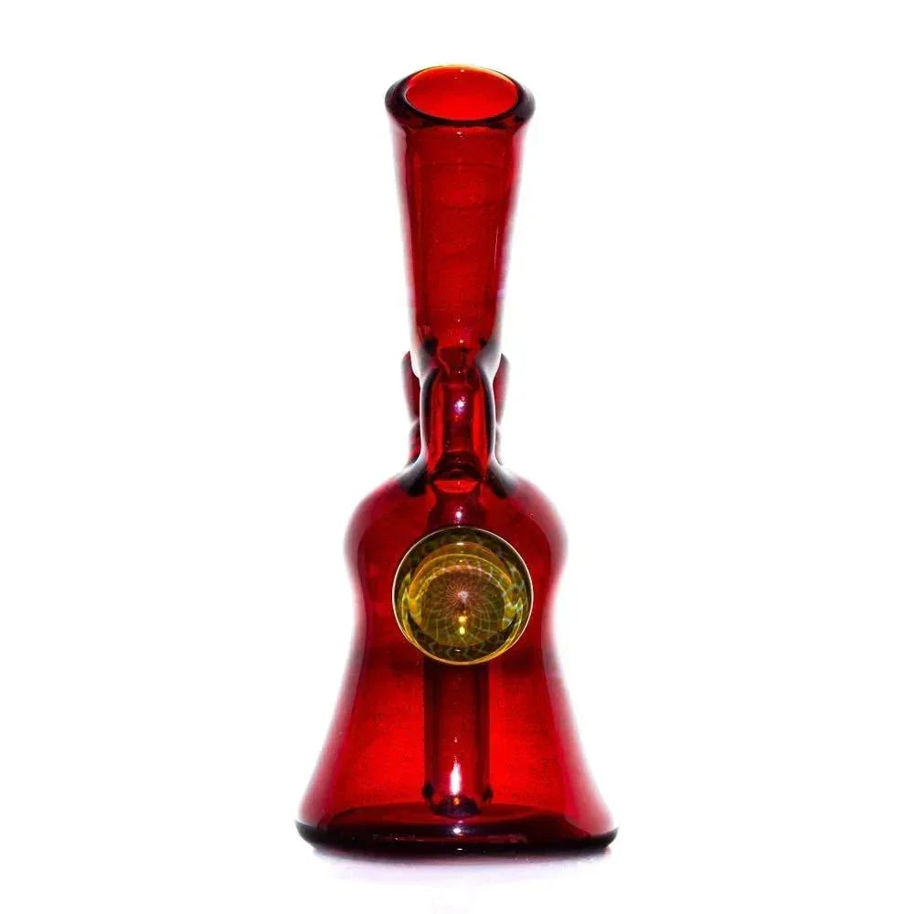 Hand-blown red glass water pipe with gold fumed accent, artfully crafted on white background.