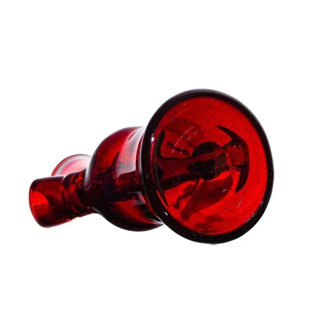 Hand-blown red glass pipe with sculpted details on a white background