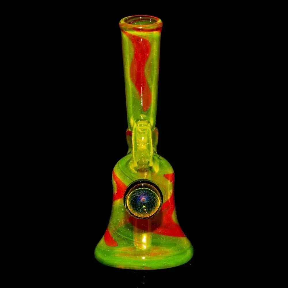 Handblown glass water pipe with yellow and red swirl design on a black background