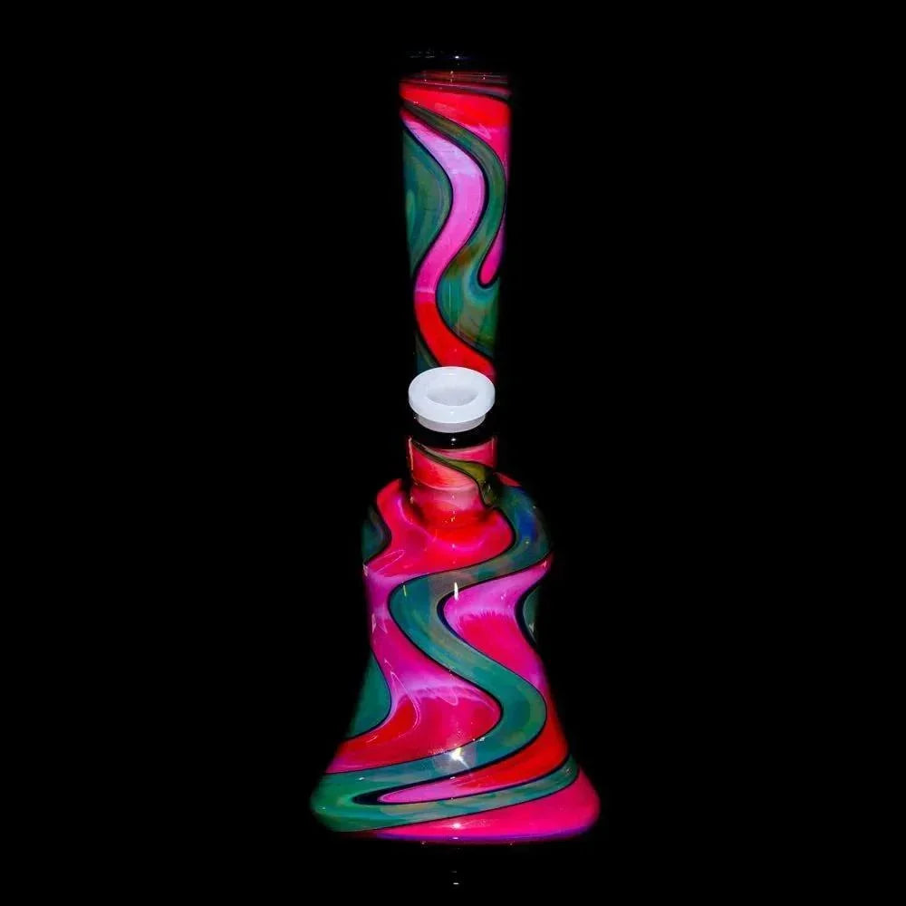 Handblown glass water pipe with pink, green, and red swirled colors on a black background