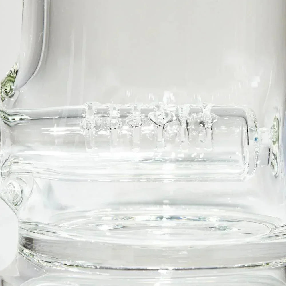 Close-up of clear glass water pipe with gridline percolator detail