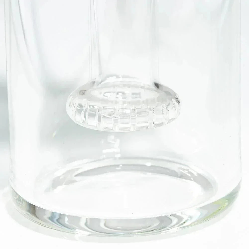 Close-up of a clear glass showerhead perc rig base with intricate percolator detail.