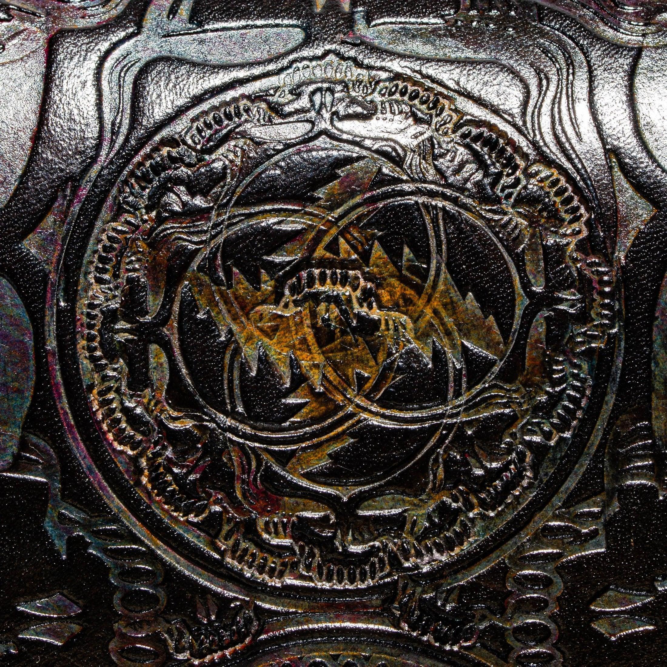 Close-up of embossed leather bag with intricate circular geometric pattern