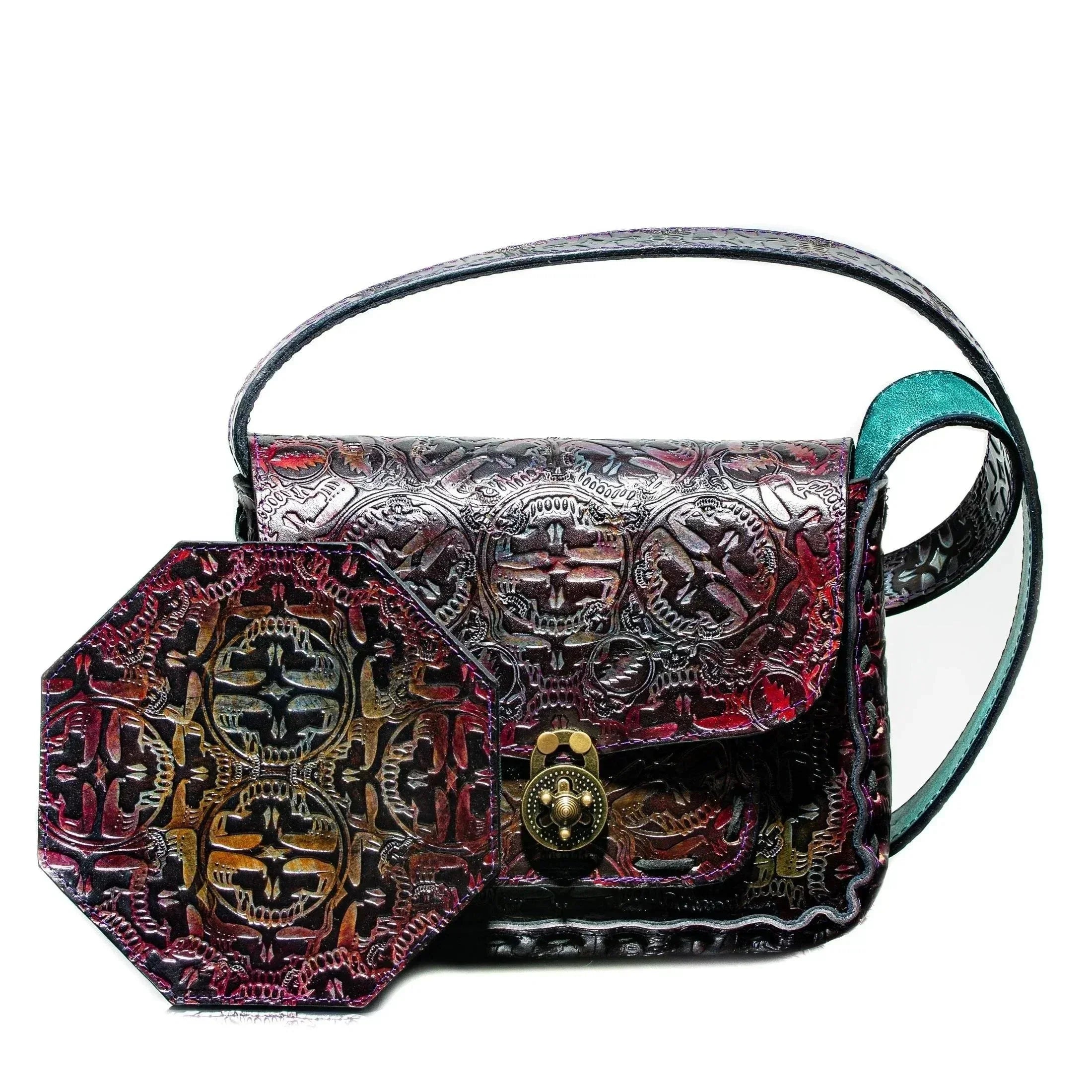 Handcrafted embossed leather side bag with intricate patterns and hexagonal matching accessory.