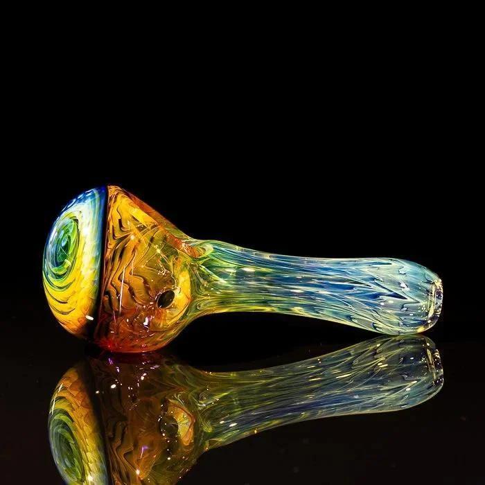Colorful hand-blown glass pipe with swirls, perfect for heady glass collectors and vaporizer enthusiasts.