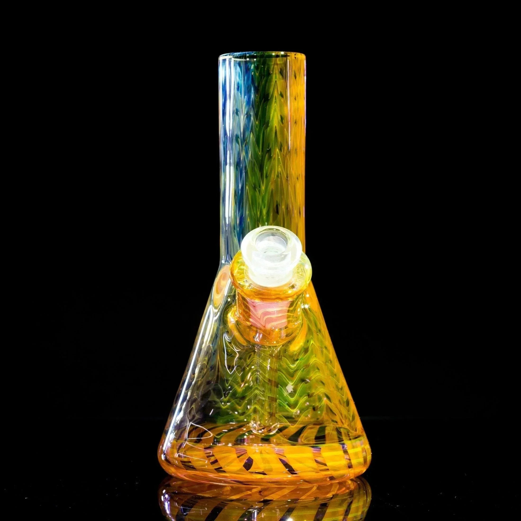 Colorful glass beaker bong with rainbow swirls and textured neck, studio shot on black background