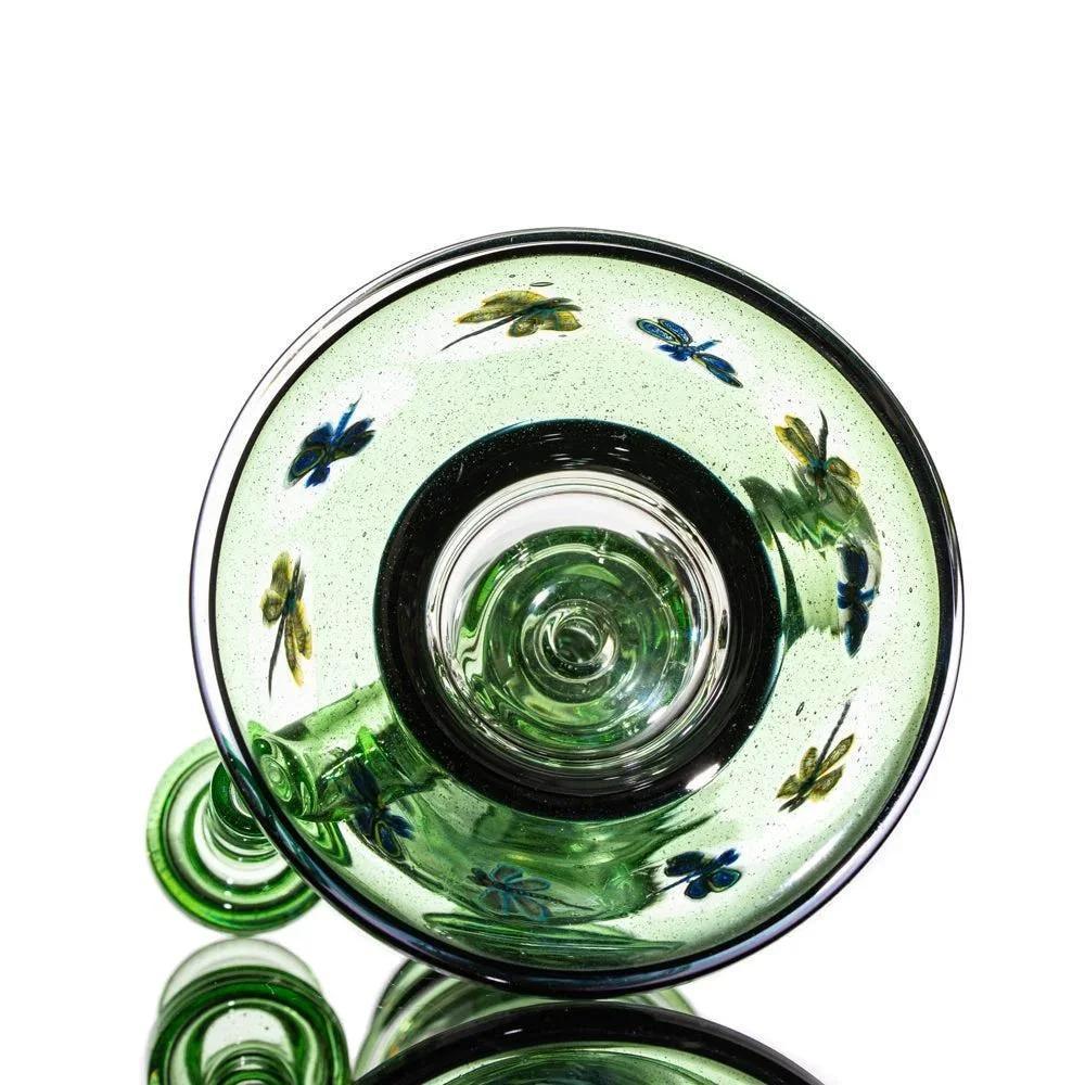 Green glass pipe with colorful butterfly designs, viewed from the top.