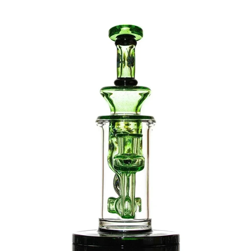 Green and clear glass water pipe with intricate recycler design on white background