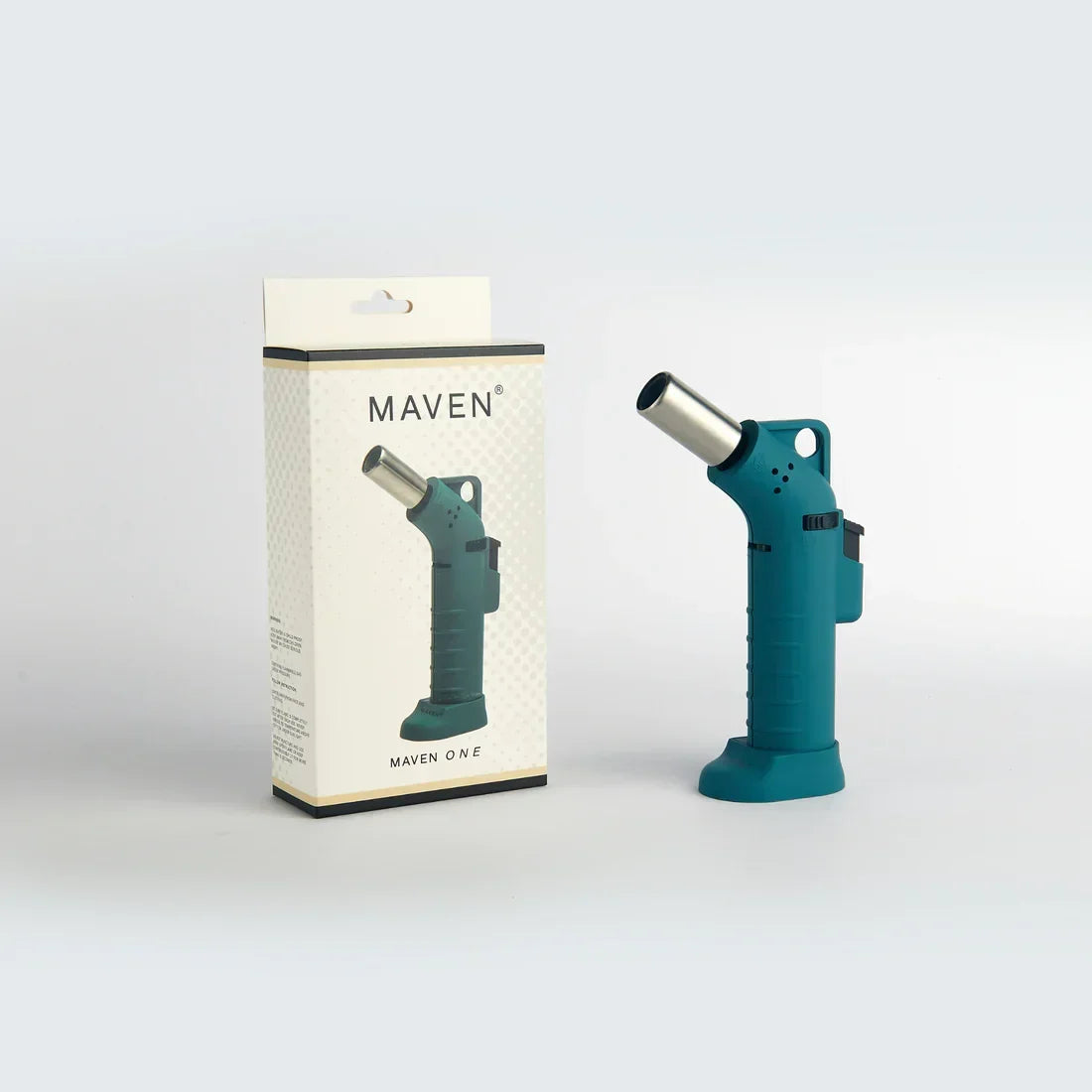 Teal handheld torch lighter with packaging, ideal for glass accessories and smoking tools