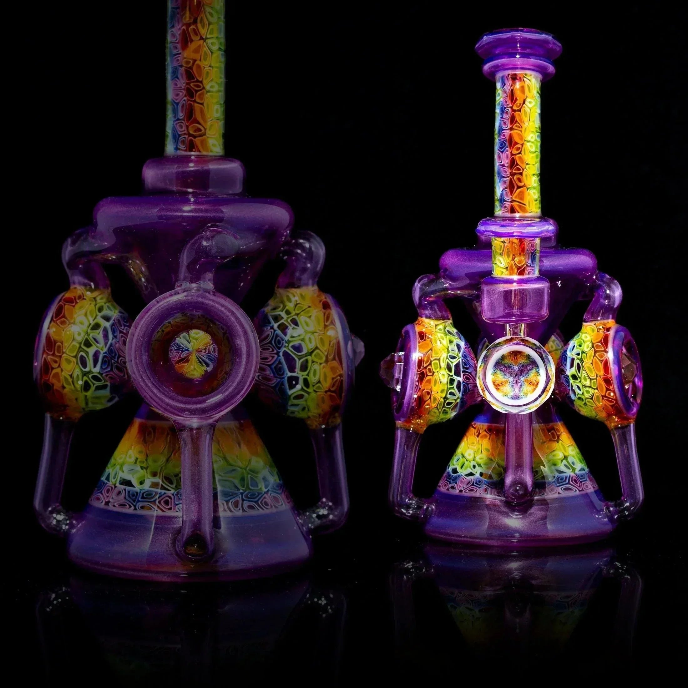 Colorful heady glass water pipe with intricate rainbow and purple patterns on black background