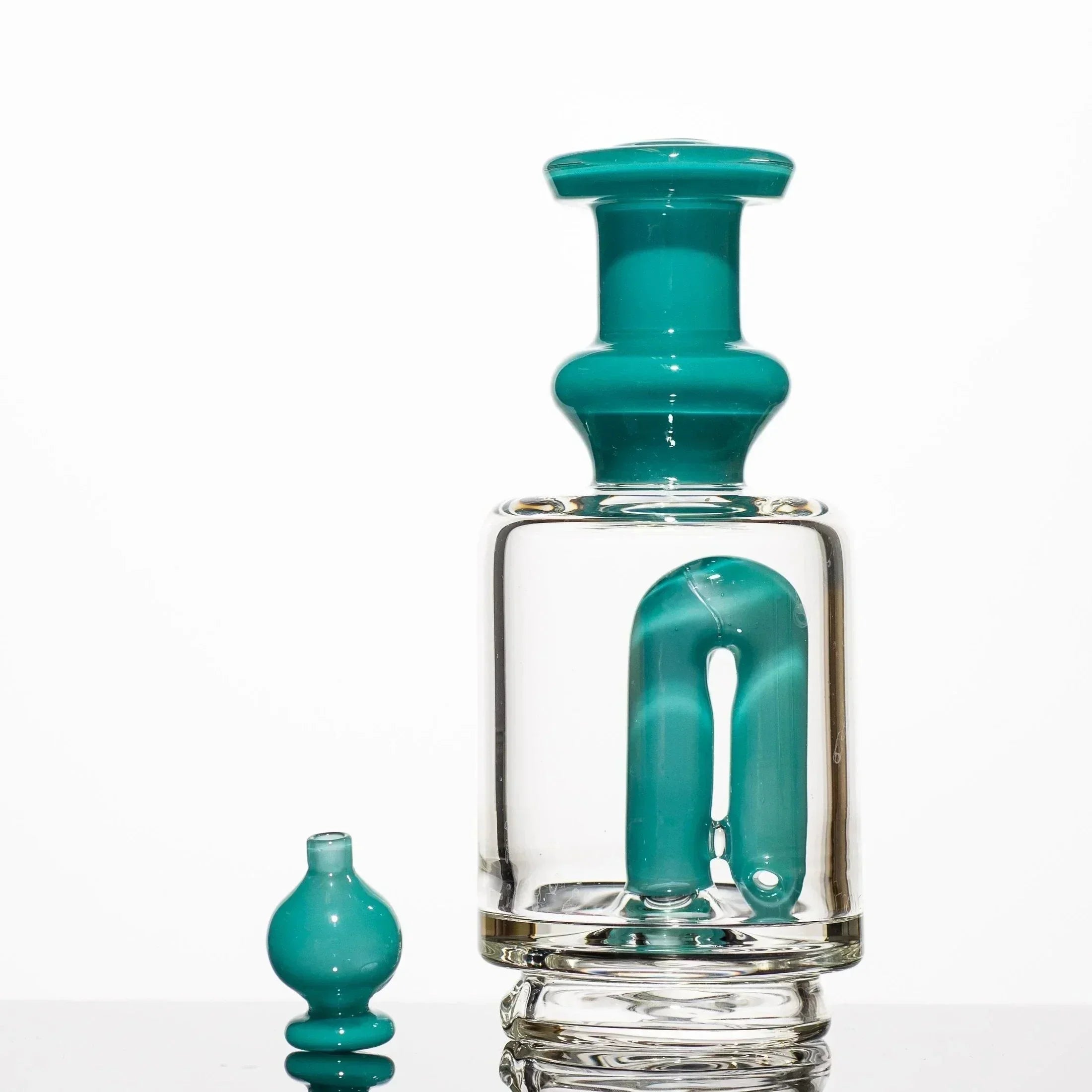 Teal and clear glass bong with matching accessory, featuring intricate heady glass design for smoking