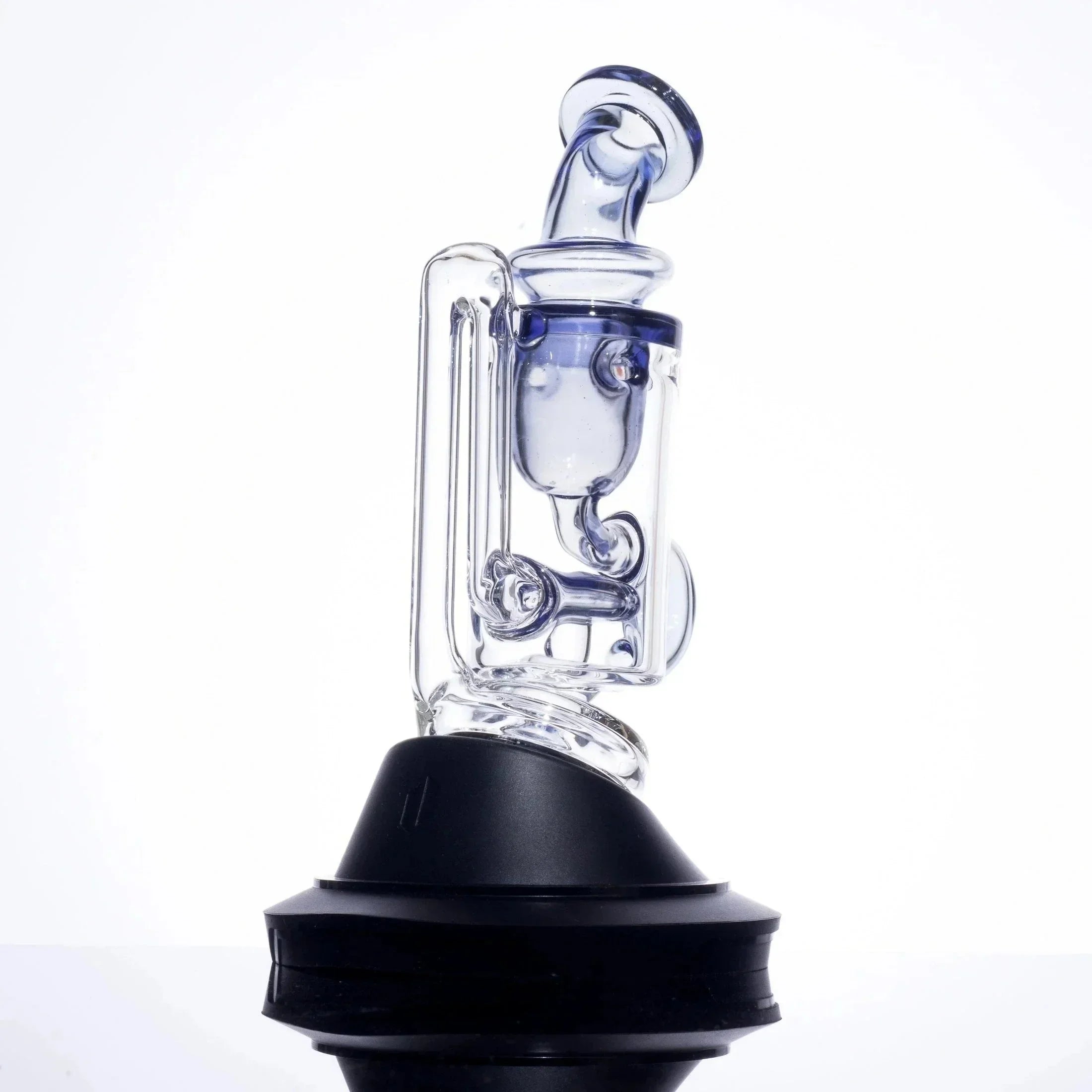 Clear glass dab rig with blue accents and black base, featuring intricate percolator design for smooth hits.