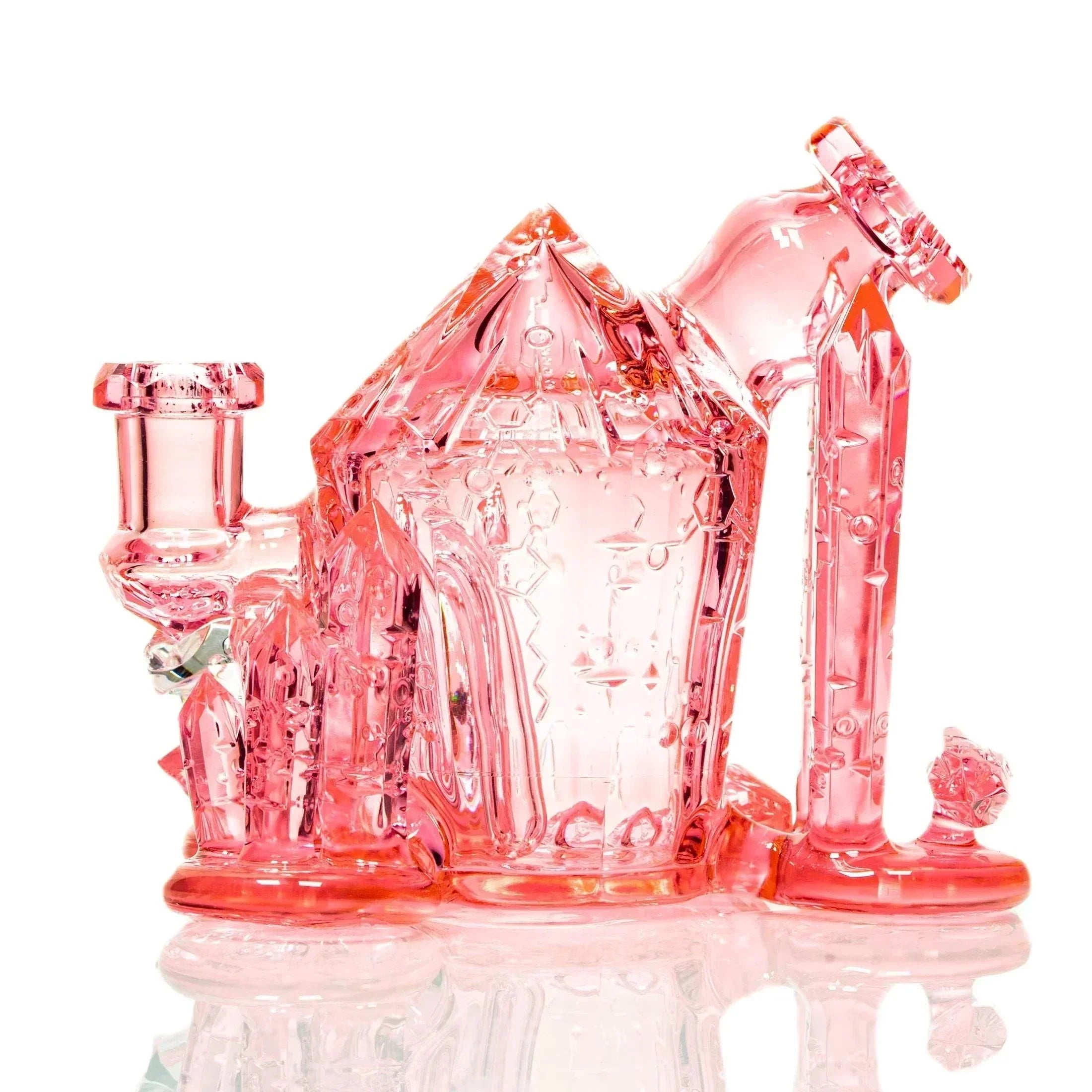 Pink crystal glass water pipe with intricate geometric designs on a white background