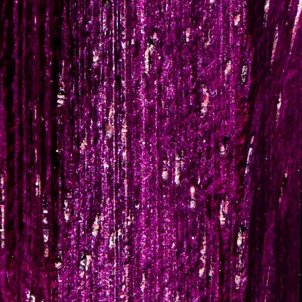 Close-up of vibrant purple wooden texture, showing detailed grain and natural pattern.