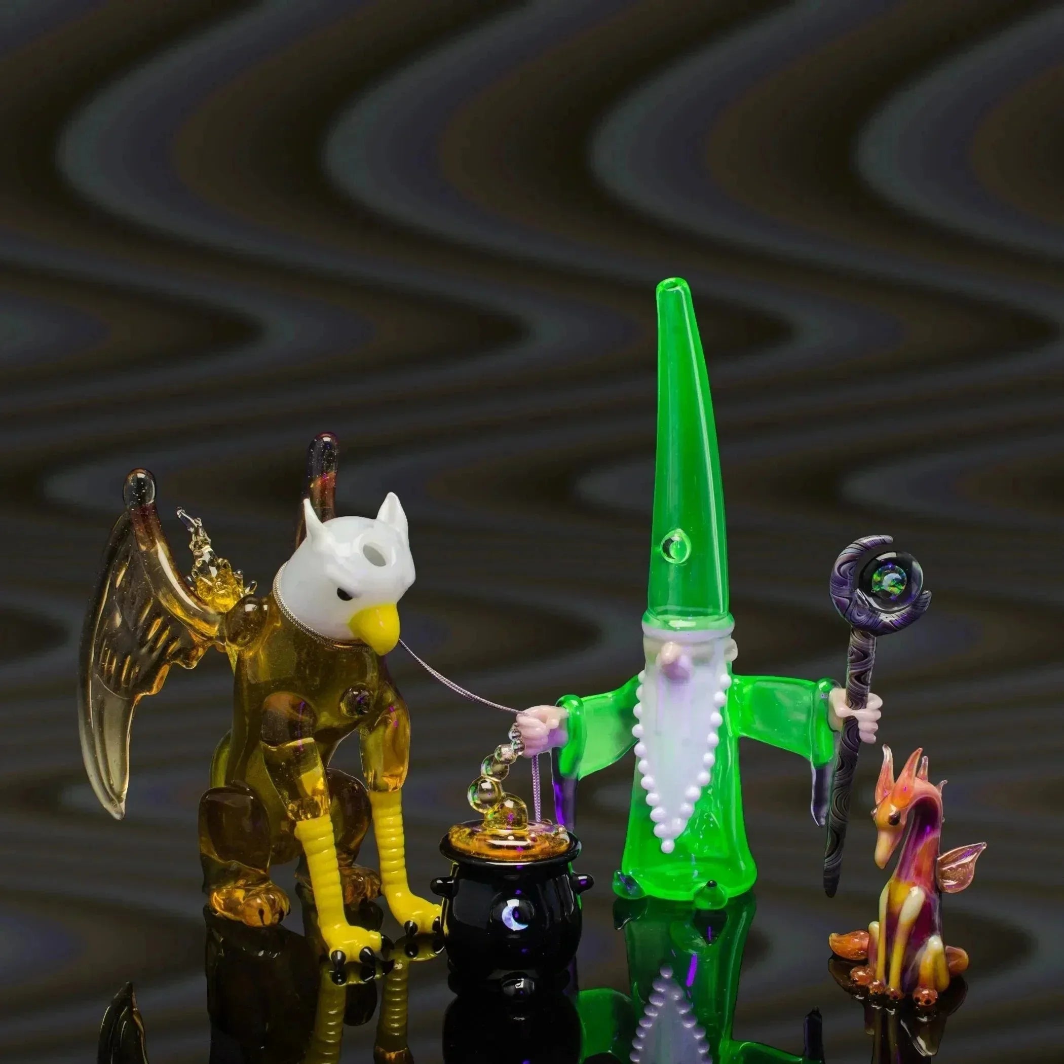 Colorful glass wizard and dragon pipe set with intricate details and vibrant colors