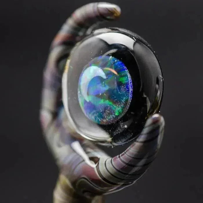Iridescent glass pipe with swirling colors and a glossy finish, showcasing heady glass artistry.