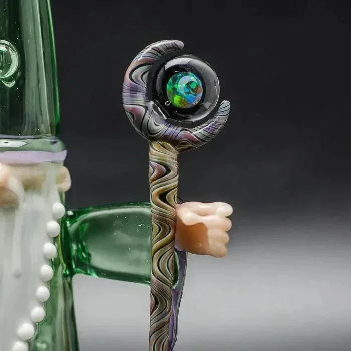 Colorful glass pipe with swirl design and opal-like orb, featuring hand grip detail