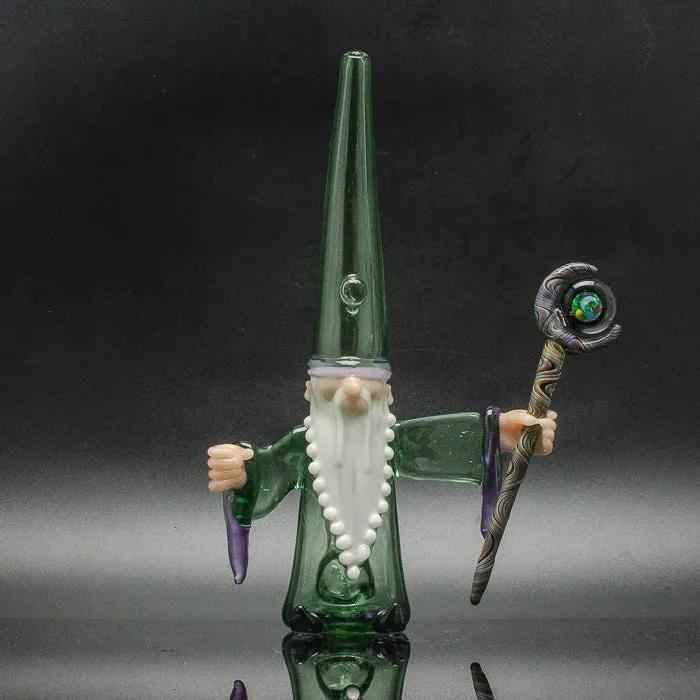 Green glass gnome with white beard holding staff, heady glass art piece